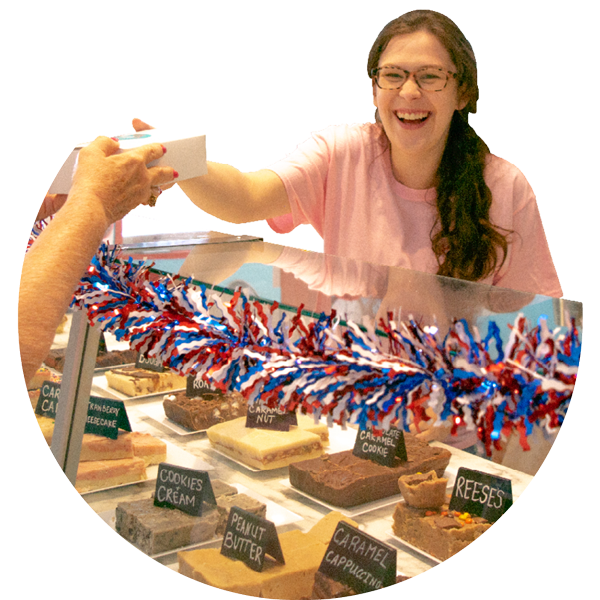 Woman being handed some fudge